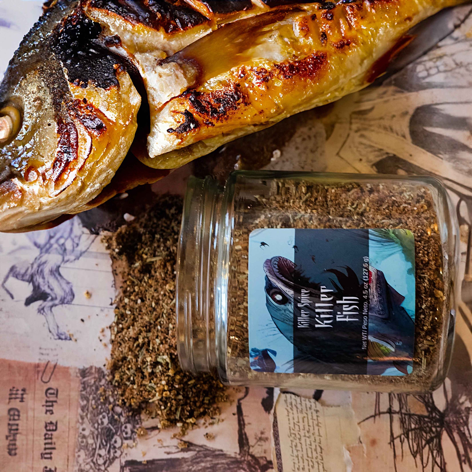 Grilled fish beside Killer Fish seasoning blend jar showcasing coffee-infused citrus and rosemary spice mix on vintage paper