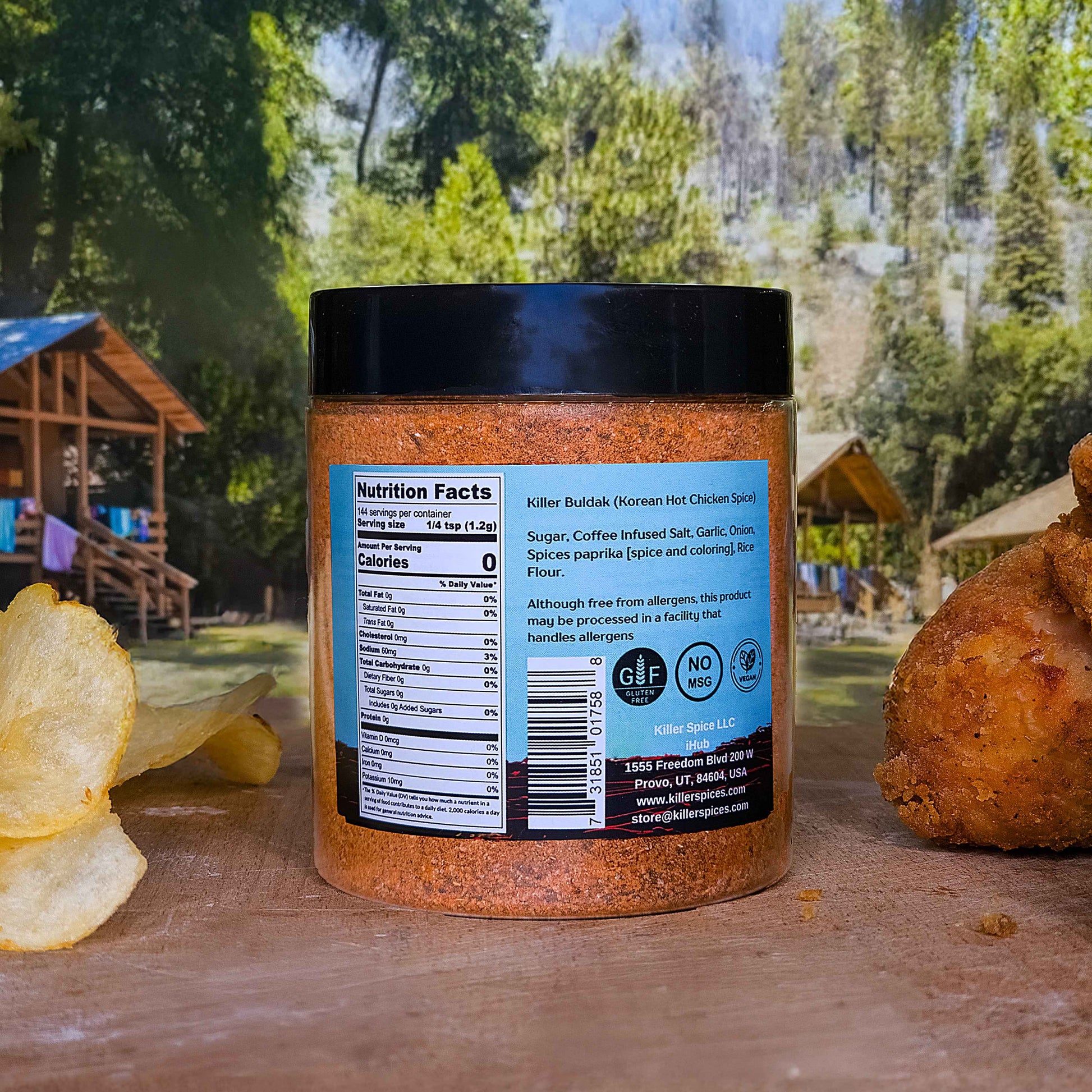 Killer Buldak coffee-infused Korean hot chicken seasoning jar shown with nutrition label on wooden surface outdoors