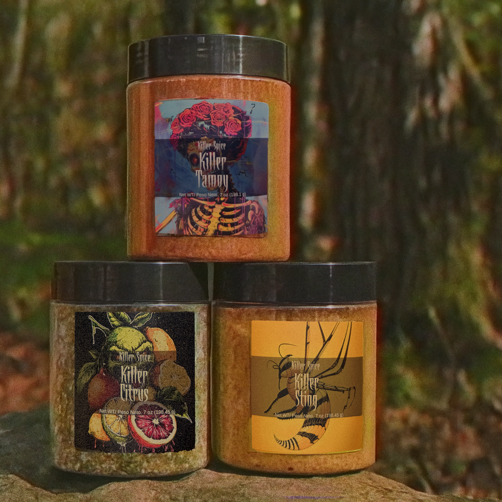 Three jars of Killer Sellers spices Killer Tampa, Killer Citrus, and Killer Sting displayed outdoors on a tree stump.
