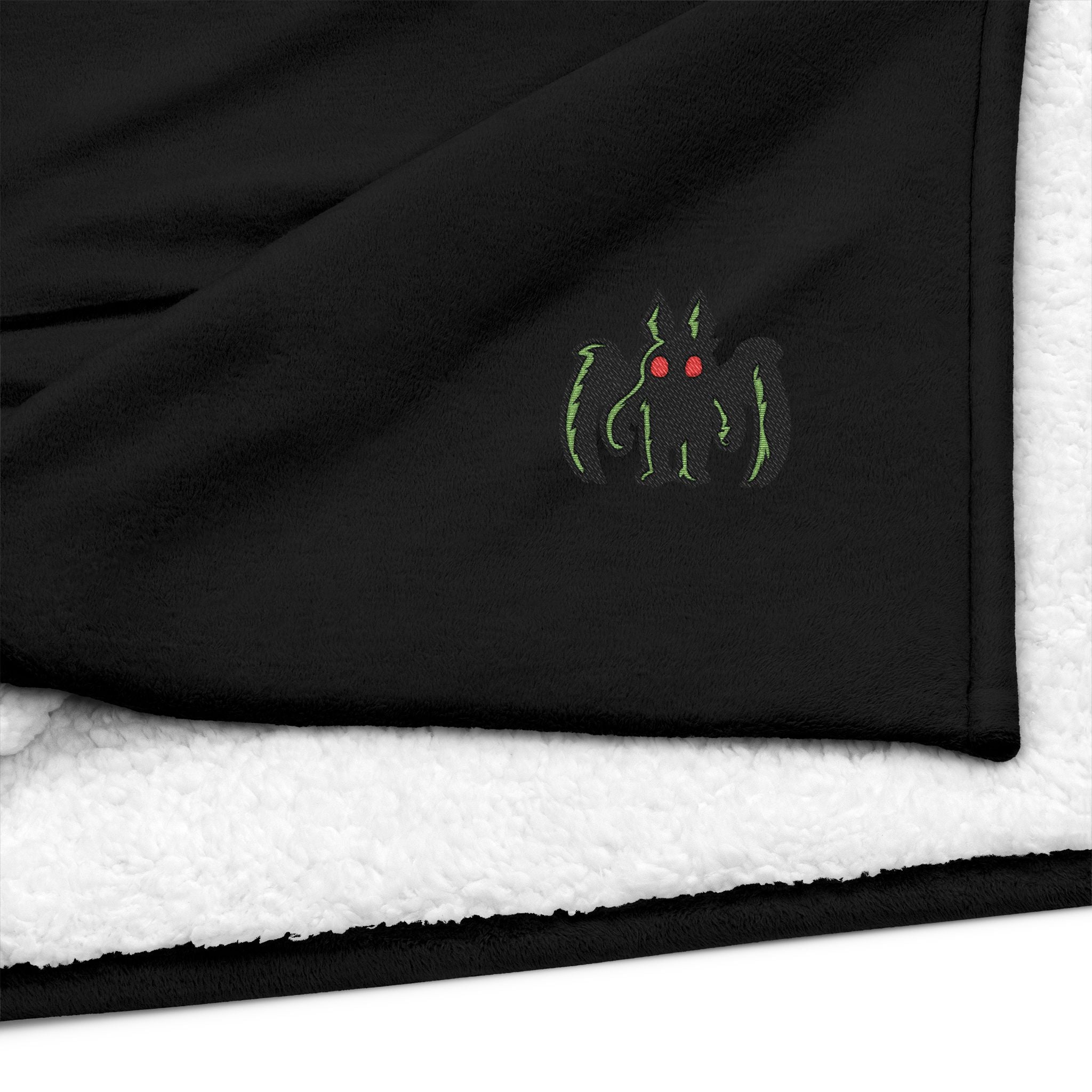 Embroidered Mothman Sherpa Blanket — Cozy Fleece Throw with Green Monster Logo