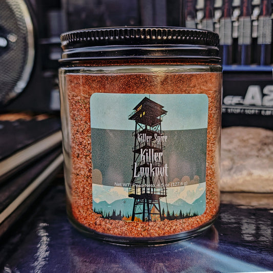 A jar of Killer Spice's Killer Lookout (Cajun Spice) seasoning with a label featuring a watchtower graphic.