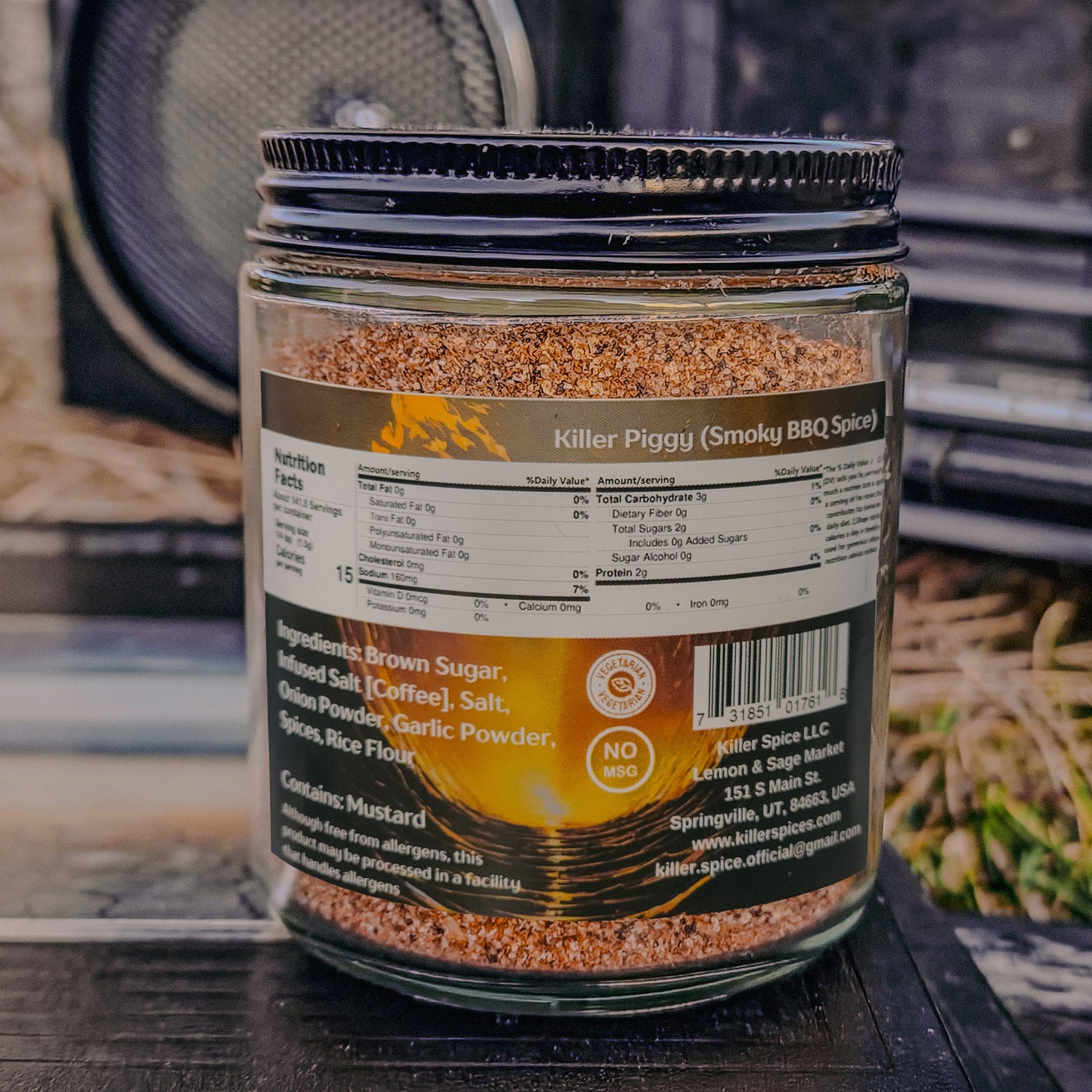 A jar of Killer Spice's Killer Piggy (Smoky BBQ Spice) on a rustic background.