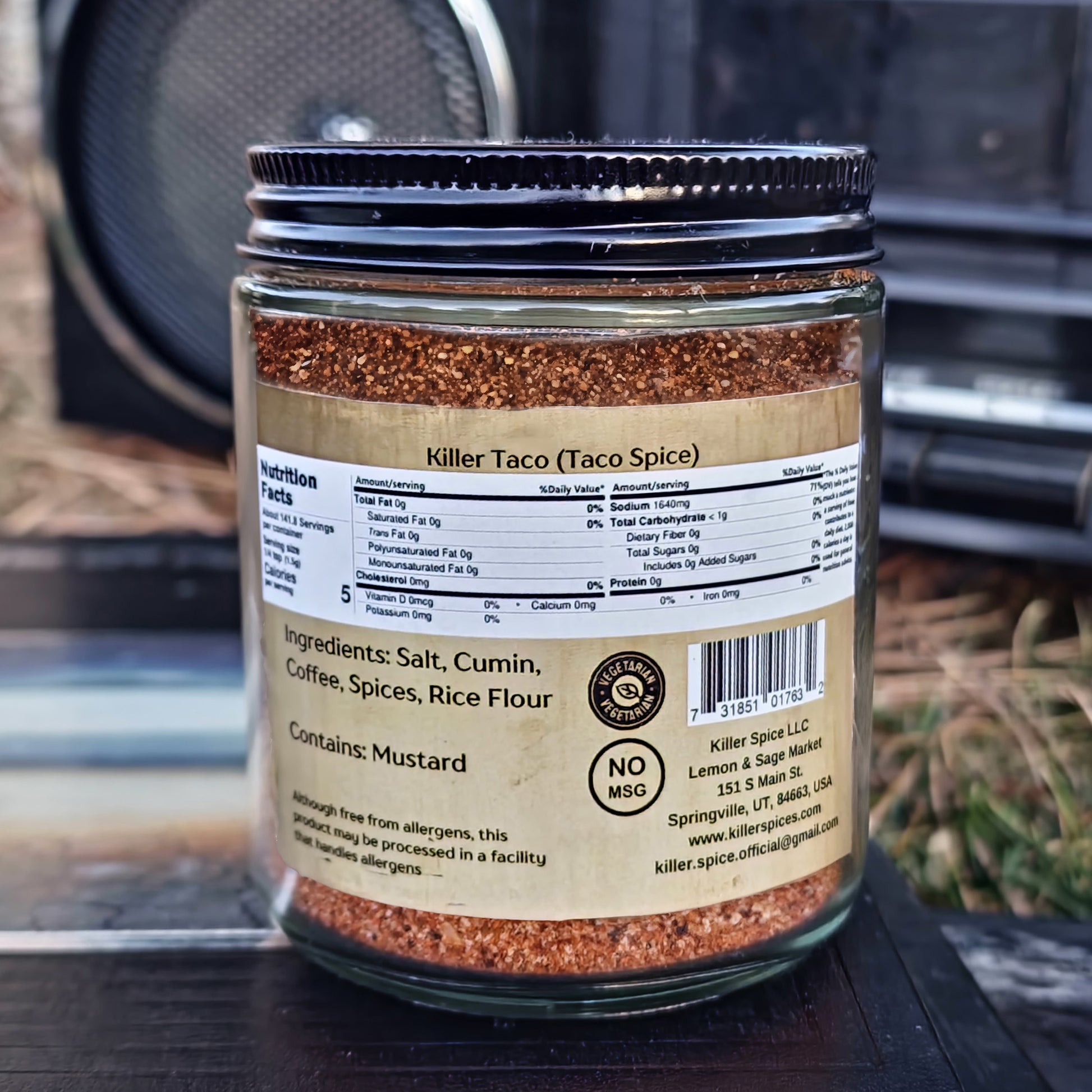A jar of Killer Spice taco seasoning blend with ingredients and nutritional facts visible on the label, perfect for enhancing Mexican cuisine.