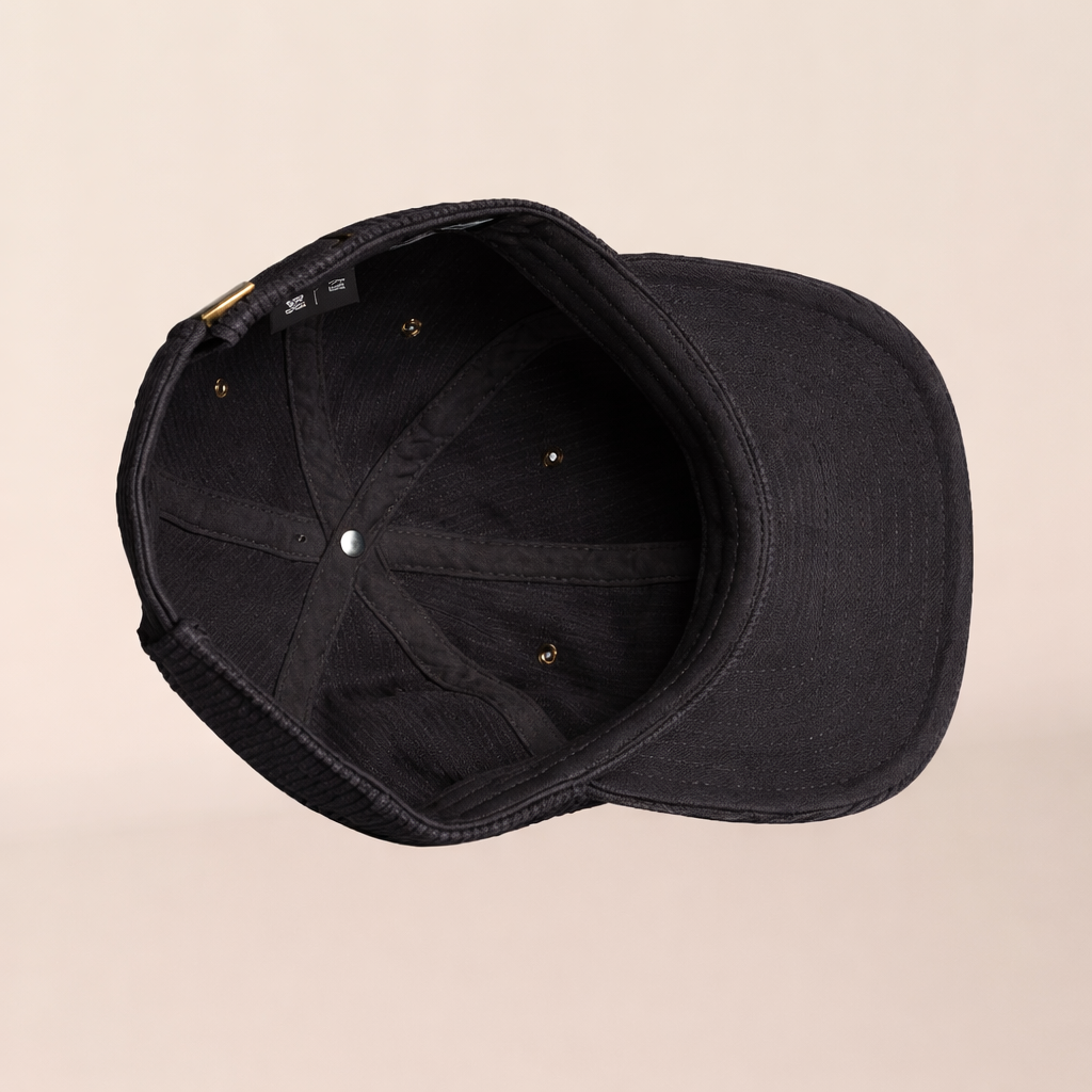 Black cap on a beige background